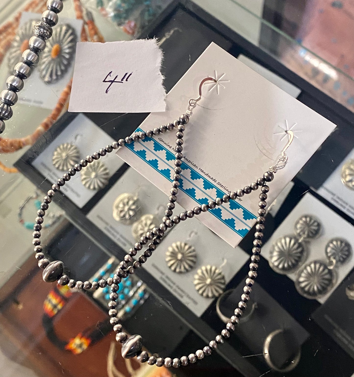 Simple lightweight and gorgeous authentic hand-strung Navajo Pearl sterling silver teardrop earrings. Hook-closure large Navajo Pearl earrings are perfect for everyday casual outfits and dressed-up ones! The perfect simple Navajo Pearl earrings also can be statement earrings. Size: 4" inches length earrings Stone: Navajo Pearls
