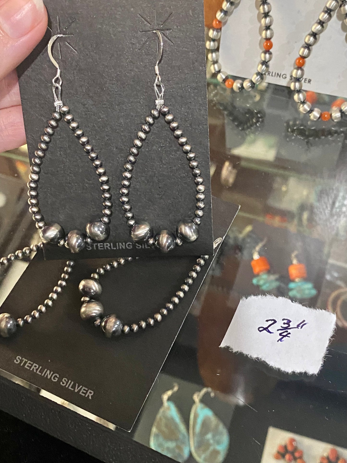 Beautiful and comfortable hand-strung Navajo pearl earrings made of sterling silver. Navajo pearl earrings with a hook closure look well with formal as well as informal outfits. The ideal Navajo pearl earrings are simple yet stylish at the same time. The perfect earrings to add to your collection of jewelry or give as a gift to someone you really care about. Each silver component is soldered shut for stability and peace of mind.  Size: 2 3/4" inches length earrings  Stone: Navajo Pearls