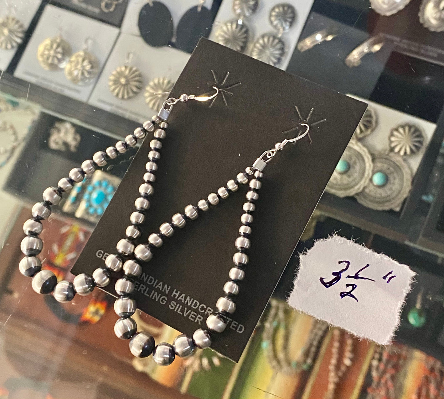 Hand-strung sterling silver Navajo pearl earrings that are easy to wear and incredibly beautiful. Earrings composed of Navajo pearls and secured by a hook go nicely with a formal or casual outfit. The perfect Navajo pearl earrings may be both simple and fashionable. The ideal earrings to add to your jewelry collection or give as a present to someone you love deeply. To provide sturdiness and peace of mind, each silver component is soldered shut. Size: 3.5" inches length earrings Stone: Navajo Pearls