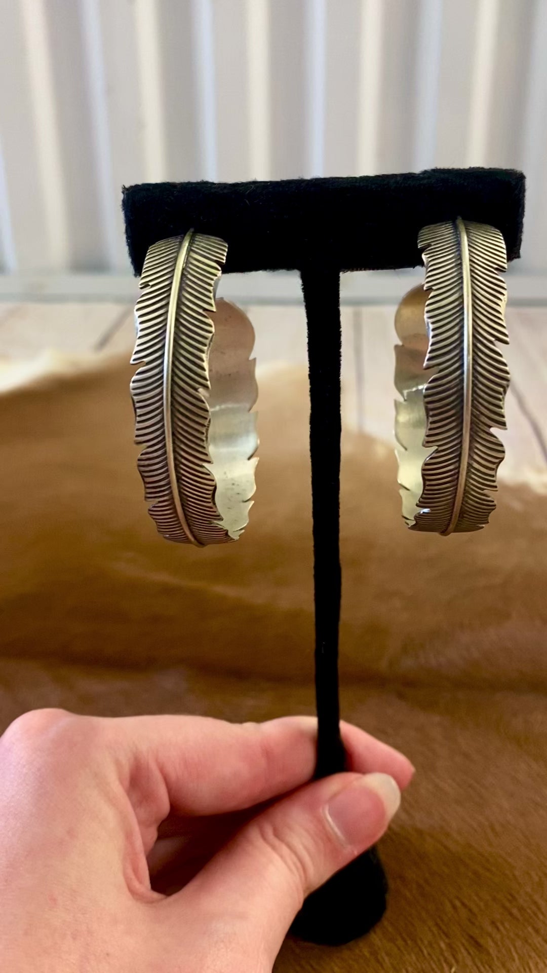The Feather Indians Silver Earrings Stunning and unique sterling silver large feather post half hoop Native American handmade earrings. Very easy to dress up or down depending on the outfit! Add these beauties to you or your loved ones jewelry collection TODAY!   Size: 2” inch long