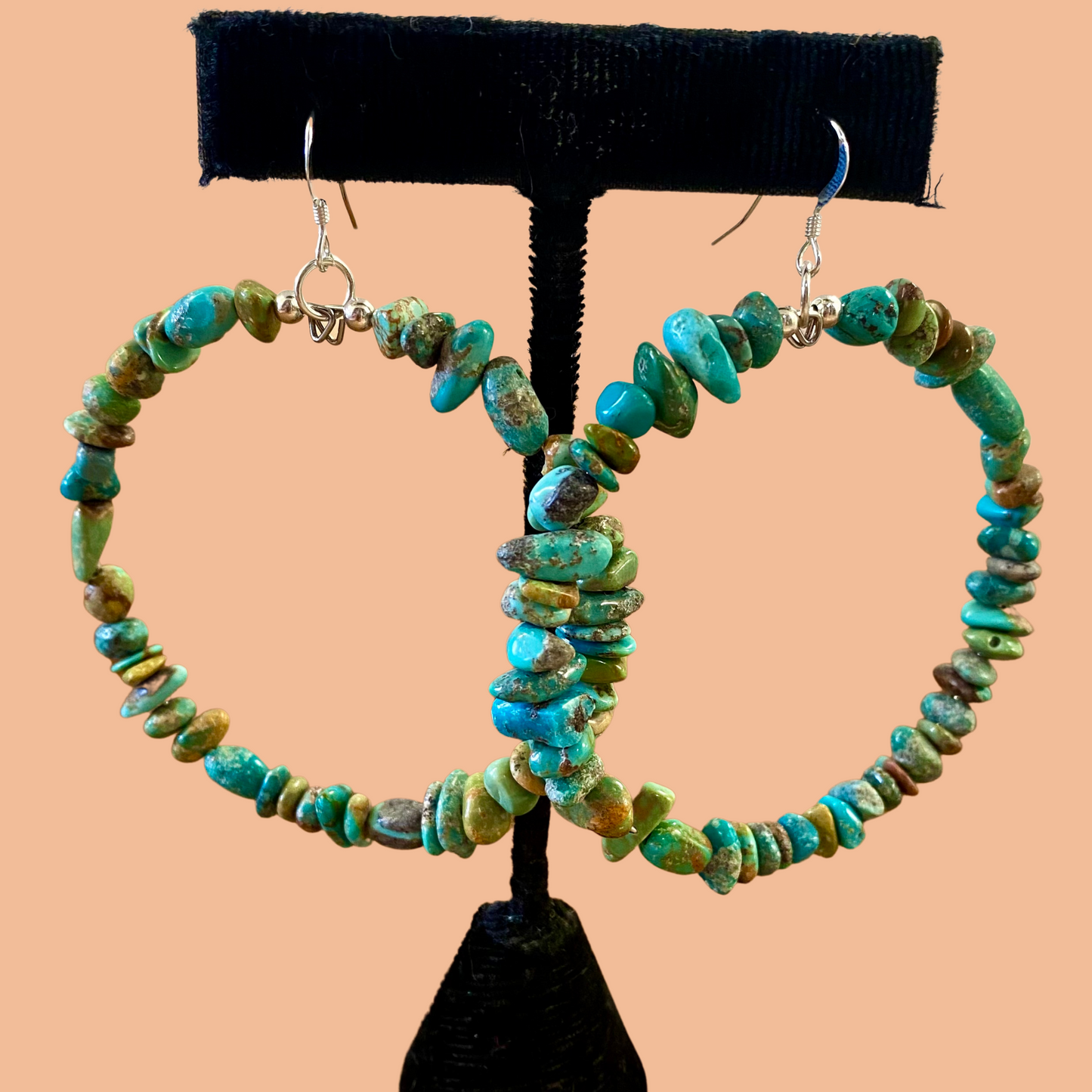 Handmade turquoise beaded Native American made hoop hook sterling silver earrings. Native American beaded hoop earrings will make for the perfect gift for your loved one or for your own jewelry collection! The perfect statement or everyday Native American beaded hoop earrings to add to your jewelry collection! These are lightweight and easy to pair with almost any outfit! Size: 2.5” Inches width X 2” Inches length Stone: Turquoise