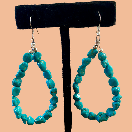 Sterling Silver Native American Made Turquoise Teardrop Earrings Lovely turquoise Native American made teardrop shape drop hook sterling silver earrings. The perfect piece of jewelry to gift to your loved one or keep for yourself! These are lightweight and simple yet still elegant. Size: 2” inch length Stone: Turquoise Teardrop Silver Turquoise Earrings, Sterling Silver Earrings