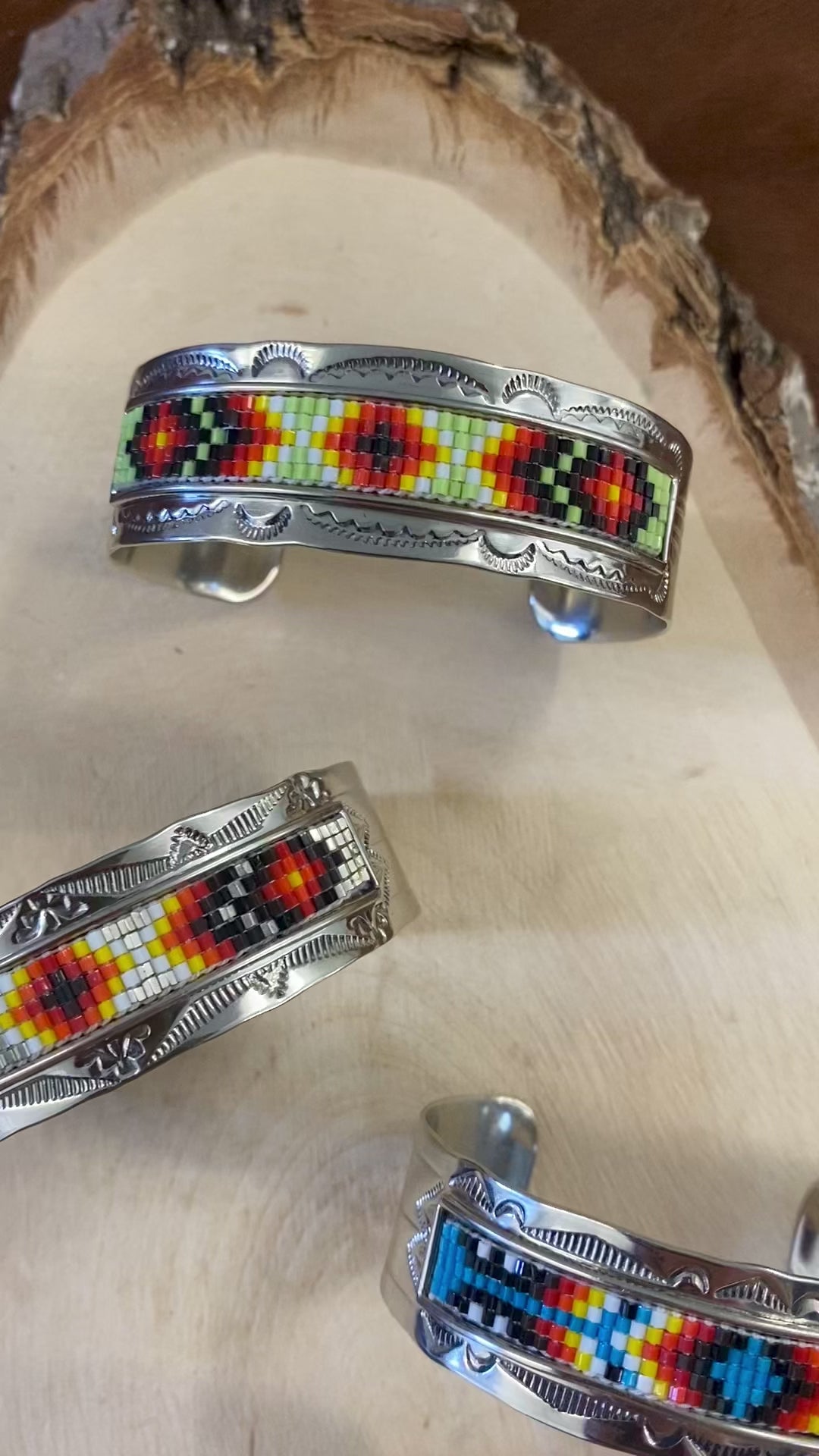 Beautiful unique stamped Nickle sliver and signed by Native American artist silversmith inside of the cuff band. Aztec seed beaded bright colorful Nickle silver cuff bracelet.   Size: 5” inches inside measurement - gap 1-1.5” inches  The Sundance Aztec Beaded Cuff