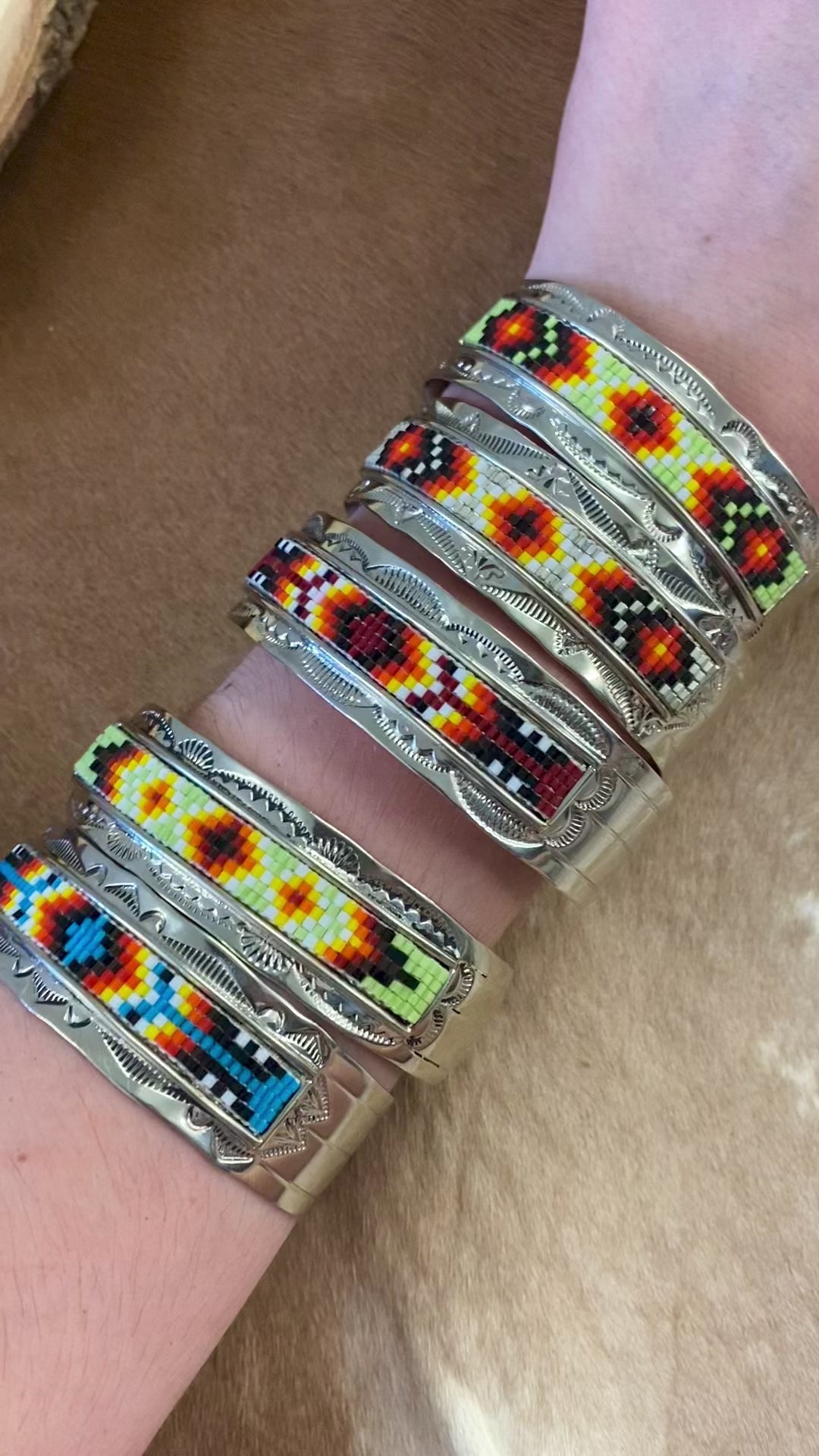 Beautiful unique stamped Nickle sliver and signed by Native American artist silversmith inside of the cuff band. Aztec seed beaded bright colorful Nickle silver cuff bracelet.   Size: 5” inches inside measurement - gap 1-1.5” inches  The Sundance Aztec Beaded Cuff