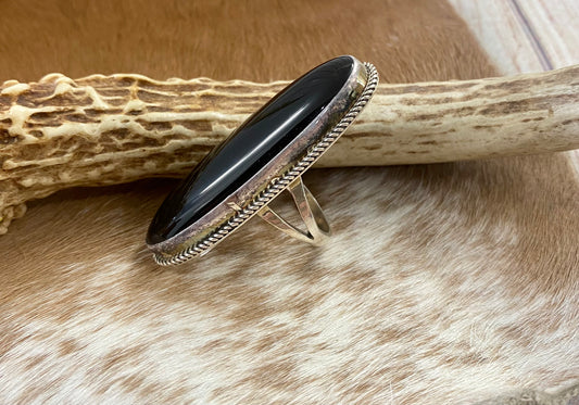 Large sterling silver onyx single stone Native made statement size 8 ring. Stamped sterling and signed V. Eriacho by Native American artist silversmith V. Eriacho. The perfect piece to add to anyone's jewelry collection. Size: 2” inches length x 3/4” inch width Ring Size: 8 Signed: YES "V. Eriacho " Hallmark/Artist: V. Eriacho Stone: Onyx