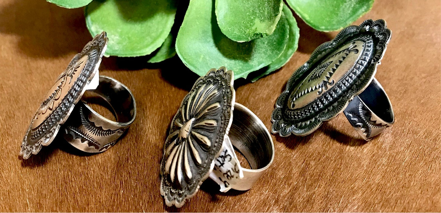 Adjustable Concho Ring Signed By Native Artist Vincent J. Platero Native American made sterling silver Concho style stamped ring. Size: Round Circle : 1.5” inch wide round Signed: YES "VJP" Hallmark/Artist: Vincent J. Platero stamped sterling and signed by their artist silversmith Vincent J. Platero. Handmade western concho style adjustable ring by Native American artist silversmith. Western statement ring.