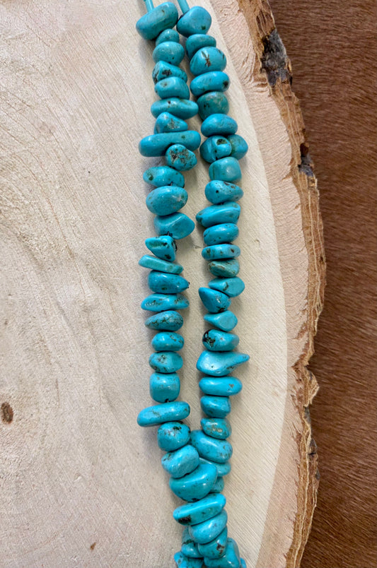 This handmade 27” inches length necklace is an absolute beauty. A stunning Native-made two-strand turquoise sliced beads necklace. Layer it or wear it alone or add a pendant to keep your look totally unique. The perfect dainty layering piece! Simple, yet striking! Size: 27” Inches Length Stone: Turquoise