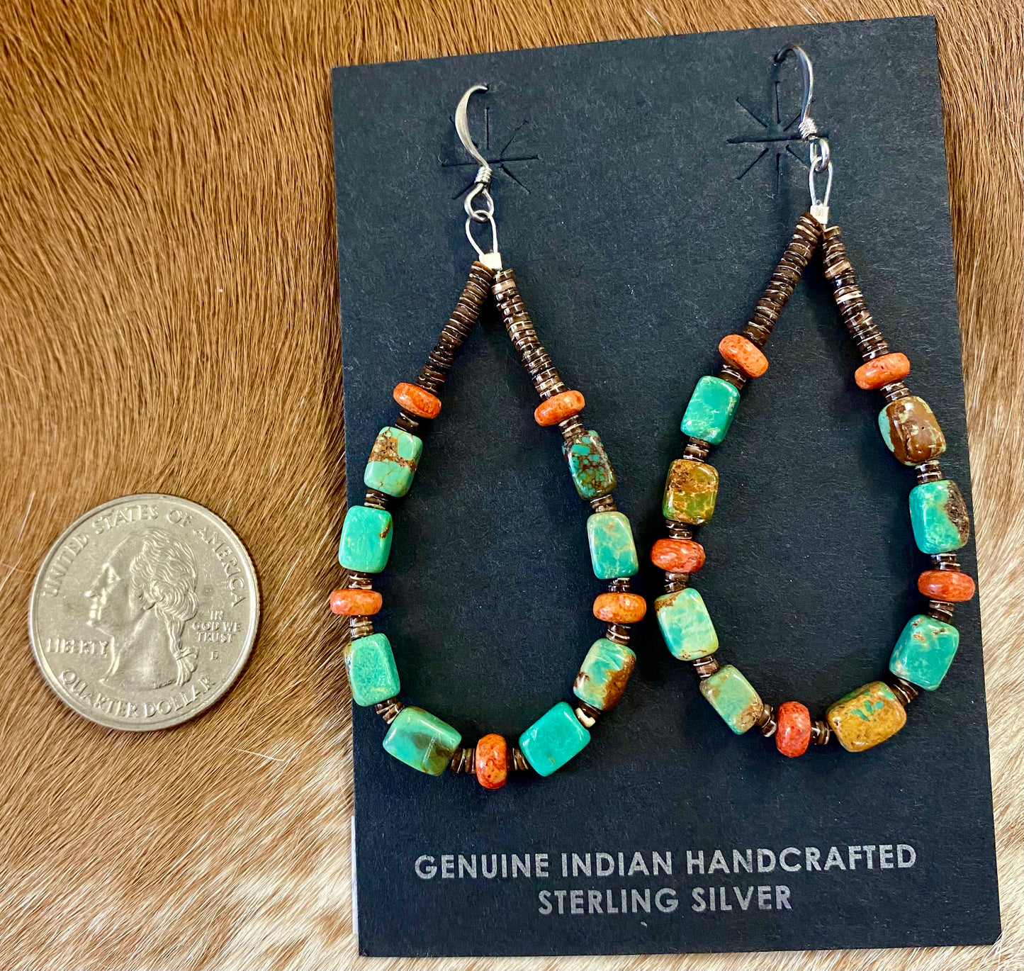 Lightweight beautiful teardrop hook sterling silver native made earrings. Turquoise, coral. and heishi mix beaded earrings. These earrings will work perfectly with so many different outfits. With blends of different colors they are sure to make a statement with any outfit! Size: 2.5” inches length x 1” inch width Stone: Turquoise and coral