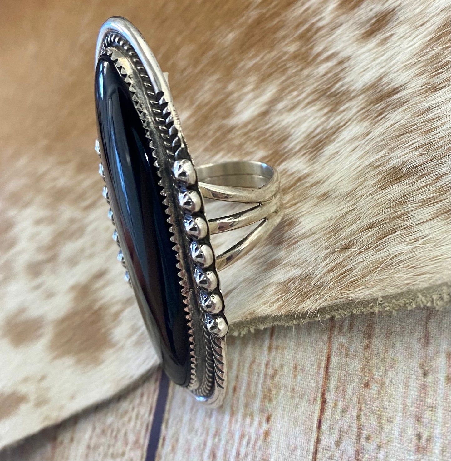 Large sterling silver onyx single stone Native made statement size 8.5 ring. Stamped sterling and signed PY by Native American artist silversmith Phillip Yazzie. The perfect piece to add to anyone's jewelry collection. Size: 2.5” inches length x 1” inch width Ring Size: 8.5 Signed: YES "PY" Hallmark/Artist: Phillip Yazzie Stone: Onyx
