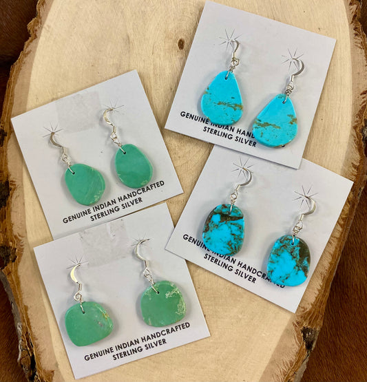 Lovely lightweight authentic turquoise slab sterling silver hook earrings. The perfect earrings to add to anyone's jewelry collection. Amazing earrings that are handmade.   Size: 1" Inch length   Stone: Turquoise