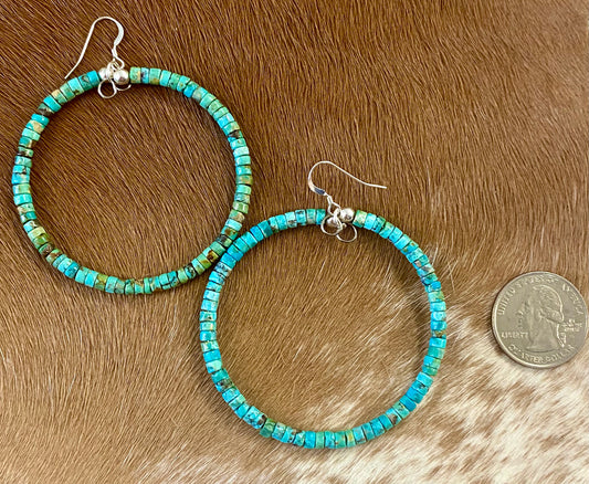 Stunning lightweight fun simple sterling silver turquoise Native made hoop earrings. The perfect everyday or dress up earrings. Size: 2.25” inches length x 2.25” Inches width Stone: Turquoise