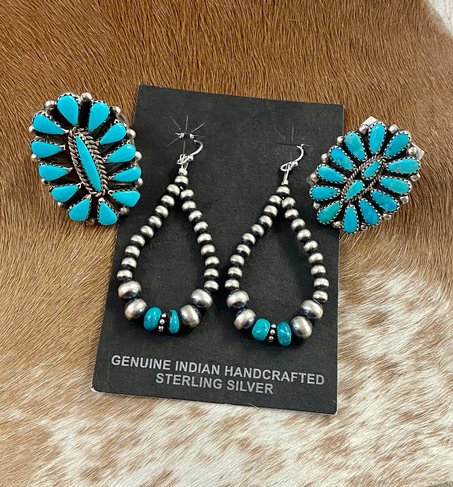 Sleeping Beauty turquoise traditional cluster sterling silver ring. Stamped sterling and signed on the back by a Zuni Native American artist silversmith. Available in size 12 1/2. The perfect piece to add to your accessory wardrobe and jewelry collection.   Size: 1.5 Inches Length X 1” Inch Width    Stone: Sleeping Beauty Turquoise   Signed: YES