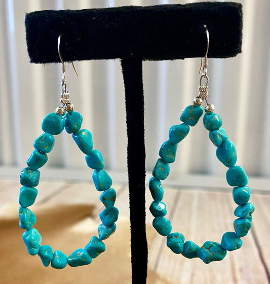 Sterling Silver Native American Made Turquoise Teardrop Earrings Lovely turquoise Native American made teardrop shape drop hook sterling silver earrings. The perfect piece of jewelry to gift to your loved one or keep for yourself! These are lightweight and simple yet still elegant. Size: 2” inch length Stone: Turquoise Teardrop Silver Turquoise Earrings, Sterling Silver Earrings
