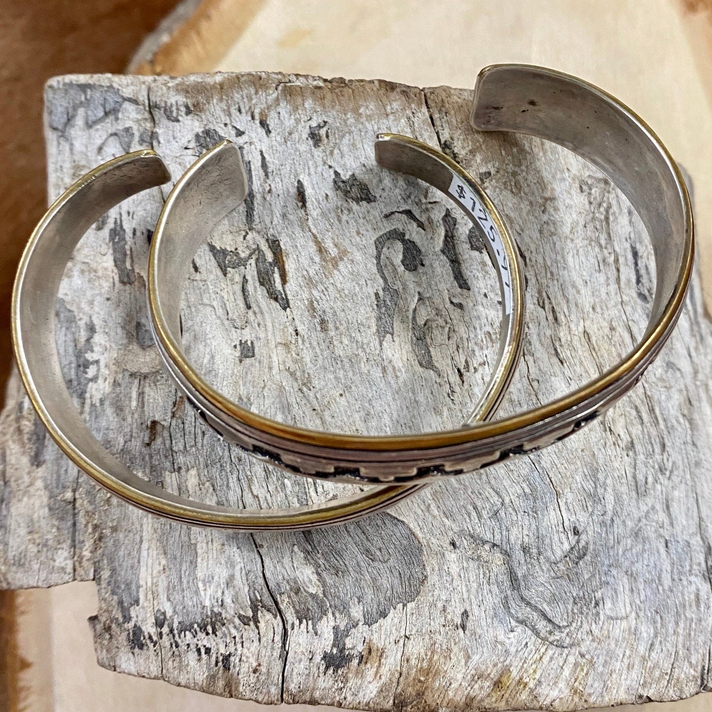 The Daryl Cuff - Ny Texas Style Boutique Silver and brass Aztec southwestern pattern Native made cuff. This unisex piece of jewelry is gorgeous. It is so unique and will add the perfect southwestern touch to any outfit! Size: 6” Inches length all the way around, 1.25” Inches length gap .25” Inch thickness width