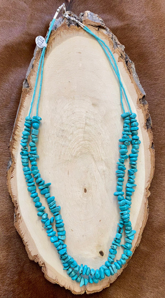 This handmade 27” inches length necklace is an absolute beauty. A stunning Native-made two-strand turquoise sliced beads necklace. Layer it or wear it alone or add a pendant to keep your look totally unique. The perfect dainty layering piece! Simple, yet striking! Size: 27” Inches Length Stone: Turquoise