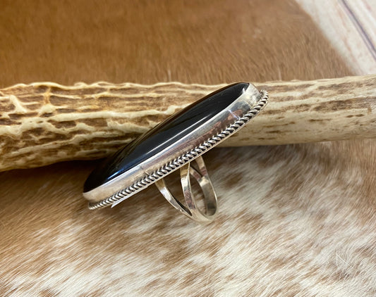 Large sterling silver onyx single stone Native made statement size 7 1/2 ring. Stamped sterling and signed V. Eriacho by Native American artist silversmith V. Eriacho. The perfect piece to add to anyone's jewelry collection.! Size: 2” inches length x 3/4” inch width Ring Size: 7 1/2 Signed: YES "V. Eriacho " Hallmark/Artist: V. Eriacho Stone: Onyx