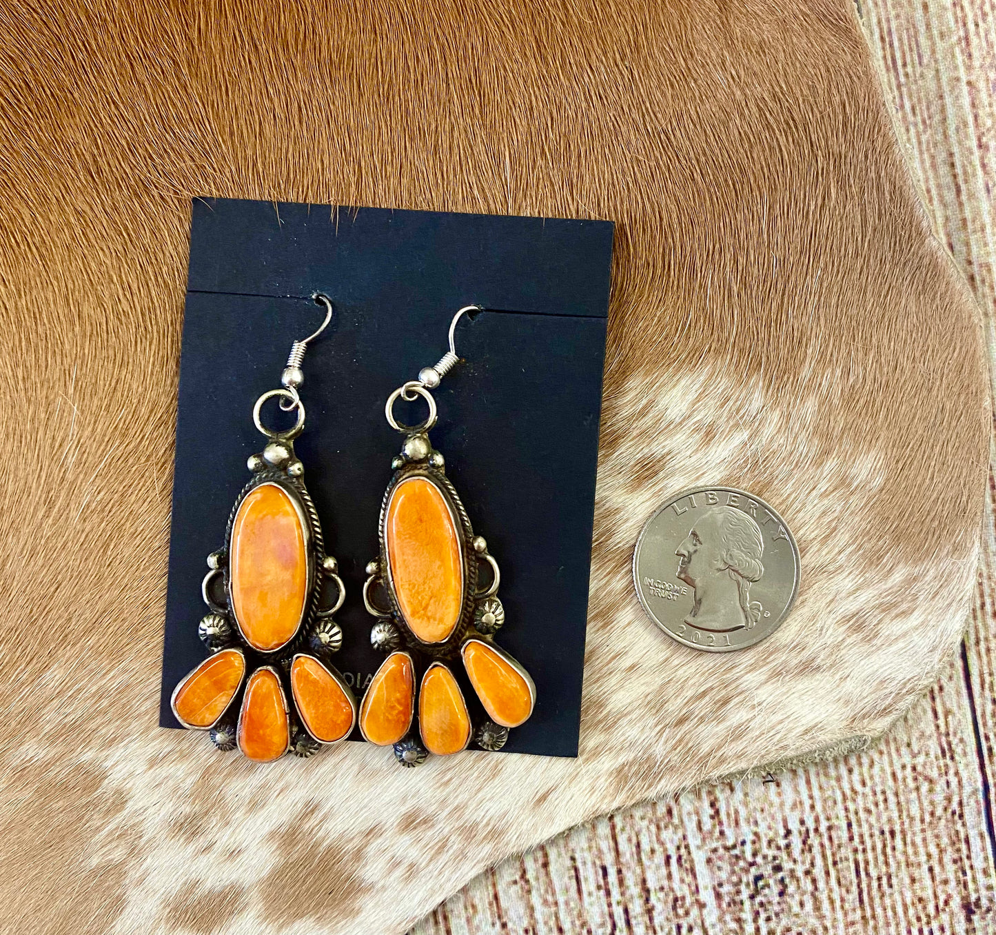 Beautiful statement spiny oyster sterling silver hook earrings. This piece is stamped sterling and signed on the back by their native artist silversmith. These will make a pop in any jewelry collection.   Size: 2" Inches length   Signed: YES  Stone: Spiny Oyster