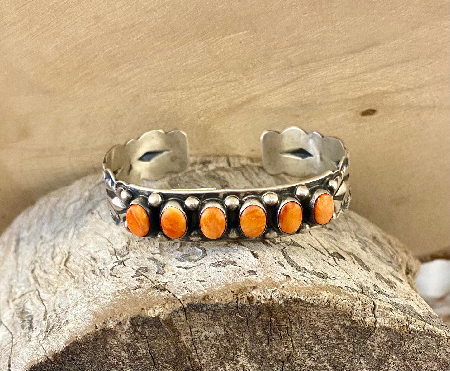 Aldine Orange Spiny Oyster Sterling Silver Cuff | Native Made Jewelry Stunning sterling silver native made stamped six stone orange spiny oyster cuff. Stamped sterling and signed on the inside of the cuff with the initial L by artist silversmith. Please see photos above for exact hallmark. This piece is gorgeous from every angle and will make a statement with any outfit.