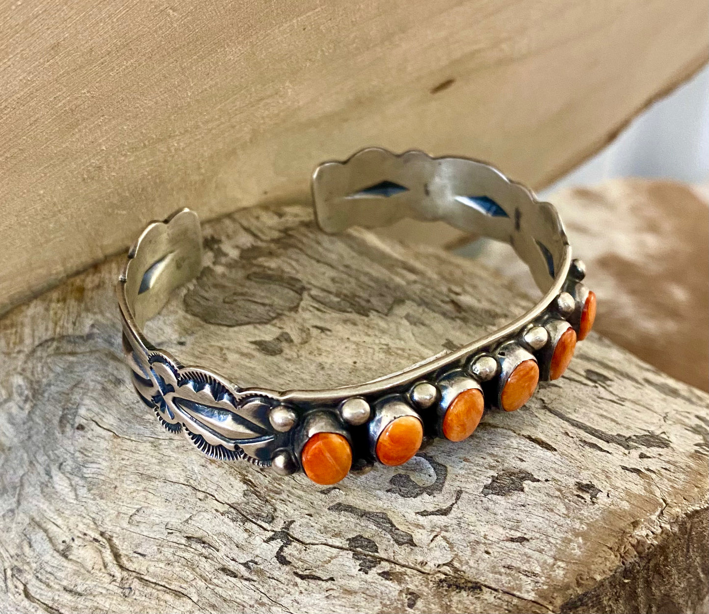 Aldine Orange Spiny Oyster Sterling Silver Cuff | Native Made Jewelry Stunning sterling silver native made stamped six stone orange spiny oyster cuff. Stamped sterling and signed on the inside of the cuff with the initial L by artist silversmith. Please see photos above for exact hallmark. This piece is gorgeous from every angle and will make a statement with any outfit.