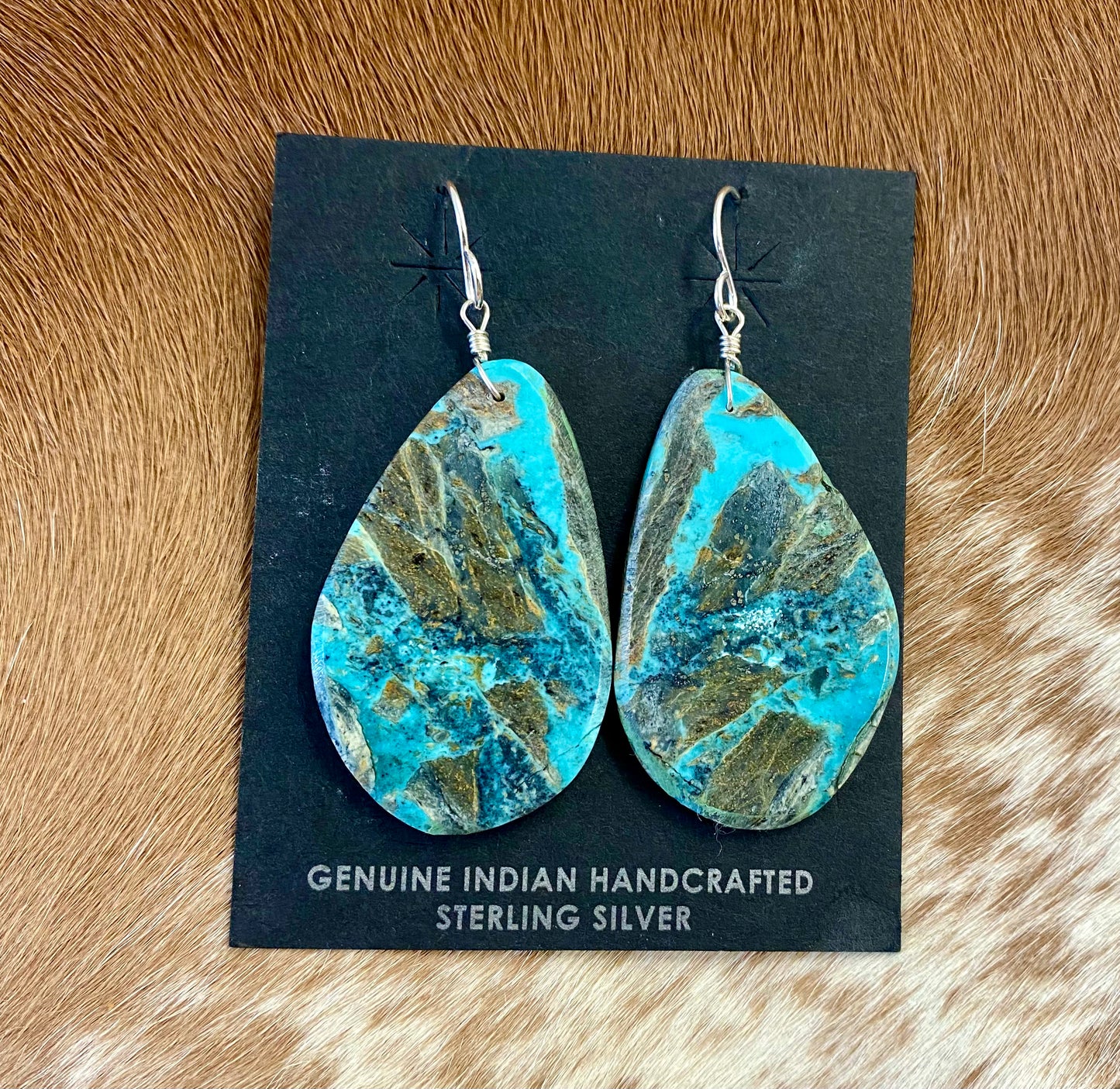 Large statement sterling silver handmade Native American made turquoise slab earrings. These are gorgeous and will make a statement with any outfit, any jewelry collection! These are made by Native American artist silversmith Ron Chavez. Size: 2” inch length Artist/Hallmark: Ron Chavez Stone: Turquoise