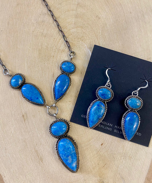 Stunning blue lapis lariat style sterling silver Native American made necklace and drop hook matching earrings set. Gorgeous sterling silver lapis hook blue lapis earrings. Perfect jewelry set to gift to your loved one or keep for your own jewelry collection! Both pieces are stamped sterling and signed "G BOYD Navajo". Size: 24” inch necklace + 1” inch earrings Stone: Lapis Signed: YES