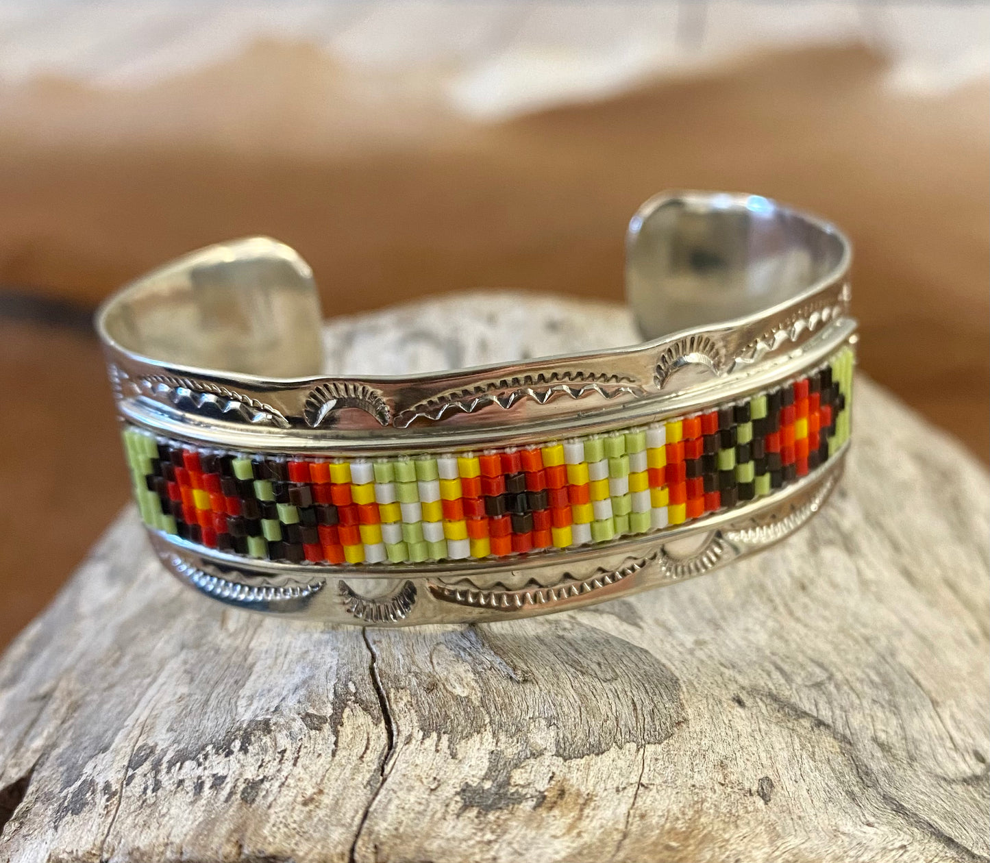 Beautiful unique stamped Nickle sliver and signed by Native American artist silversmith inside of the cuff band. Aztec seed beaded bright colorful Nickle silver cuff bracelet.   Size: 5” inches inside measurement - gap 1-1.5” inches  The Texas Queen Aztec Beaded Cuff