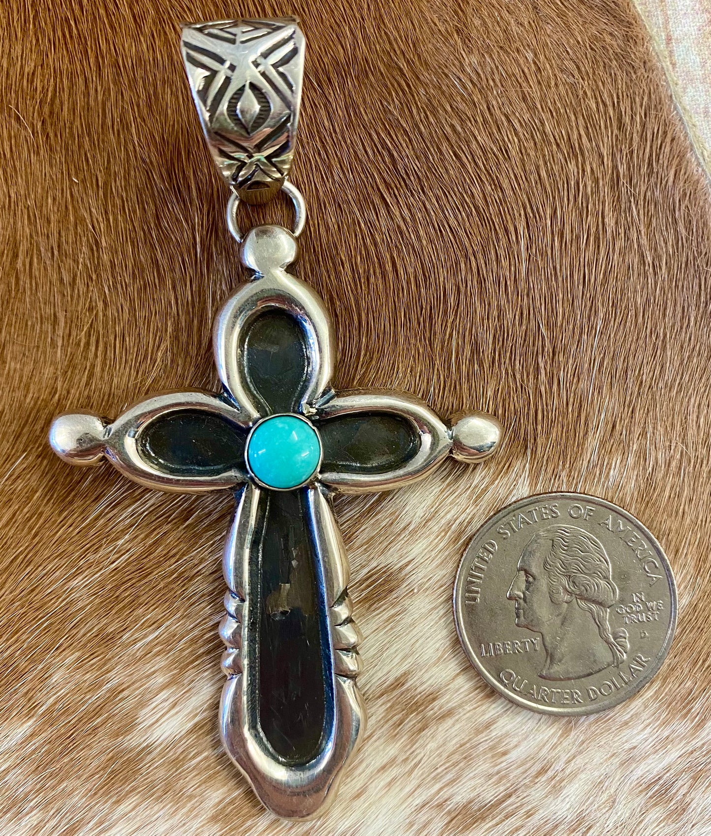 Beautiful sterling silver Native made turquoise cross pendant. Stamped sterling and signed H. JOE by Native American artist silversmith. The perfect cross to wear on any length chain necklace or a 6-7mm Navajo pearl necklace. Size: 3” Inches length without bale x 2” inches width - bale .5” inch length Signed: YES "H. JOE" Hallmark/Artist: H. JOE Stone: Turquoise