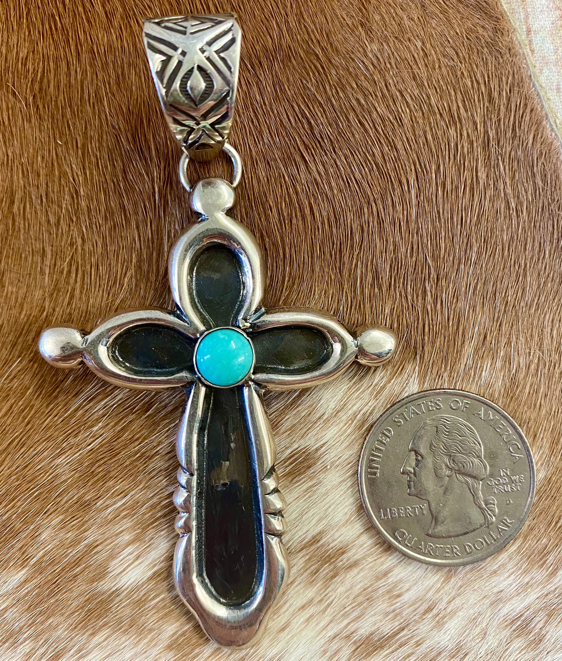 Beautiful sterling silver Native made turquoise cross pendant. Stamped sterling and signed H. JOE by Native American artist silversmith. The perfect cross to wear on any length chain necklace or a 6-7mm Navajo pearl necklace.   Size: 3” Inches length without bale x 2” inches width - bale .5” inch length   Signed: YES "H. JOE"  Hallmark/Artist: H. JOE  Stone: Turquoise