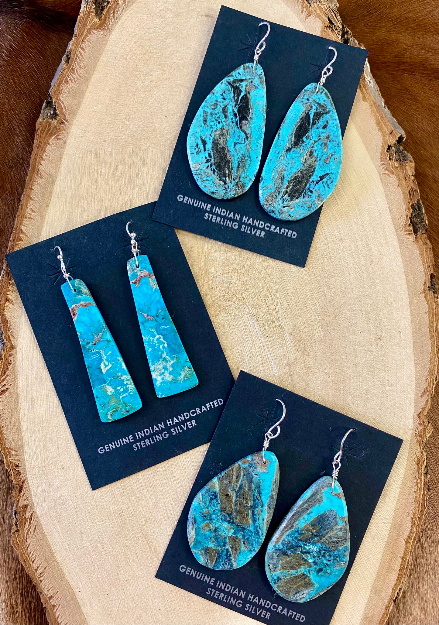 Gorgeous unique large turquoise slab sterling silver Native American made earrings. Beautiful statement handmade earrings, perfect for so many different occasions. From weddings, NFR, to everyday wear! Size: 2” inch length Stone: Turquoise Native American Made Sterling Silver Large Turquoise Slab Earrings