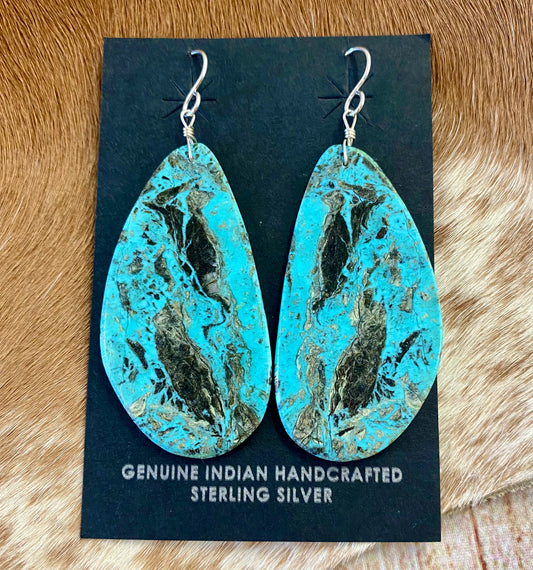 Large statement sterling silver handmade Native American made turquoise slab earrings. These are gorgeous and will make a statement with any outfit, any jewelry collection! These are made by Native American artist silversmith Ron Chavez. Size: 2” inch length Artist/Hallmark: Ron Chavez Stone: Turquoise
