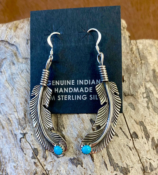 Native American Made Turquoise Feather Hook Sterling Silver Earrings Beautiful lightweight turquoise sterling silver Native American handmade feather hook earrings. These earrings are so fun and easy to pair with so many different outfits. Keep for yourself or gift to a loved one. Hallmark/Artist: Louise Joe Stone: Turquoise | Turquoise Feather Earrings, Silver Native Made Earrings
