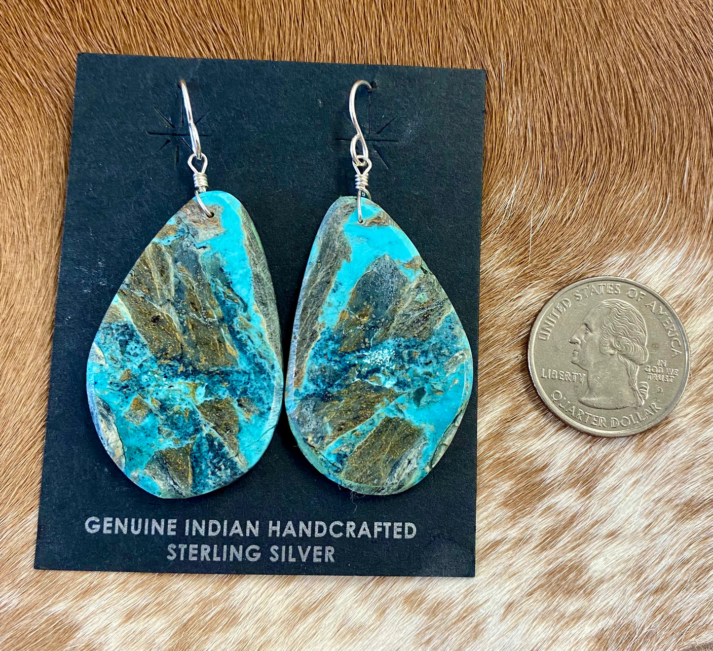 Large statement sterling silver handmade Native American made turquoise slab earrings. These are gorgeous and will make a statement with any outfit, any jewelry collection! These are made by Native American artist silversmith Ron Chavez. Size: 2” inch length Artist/Hallmark: Ron Chavez Stone: Turquoise