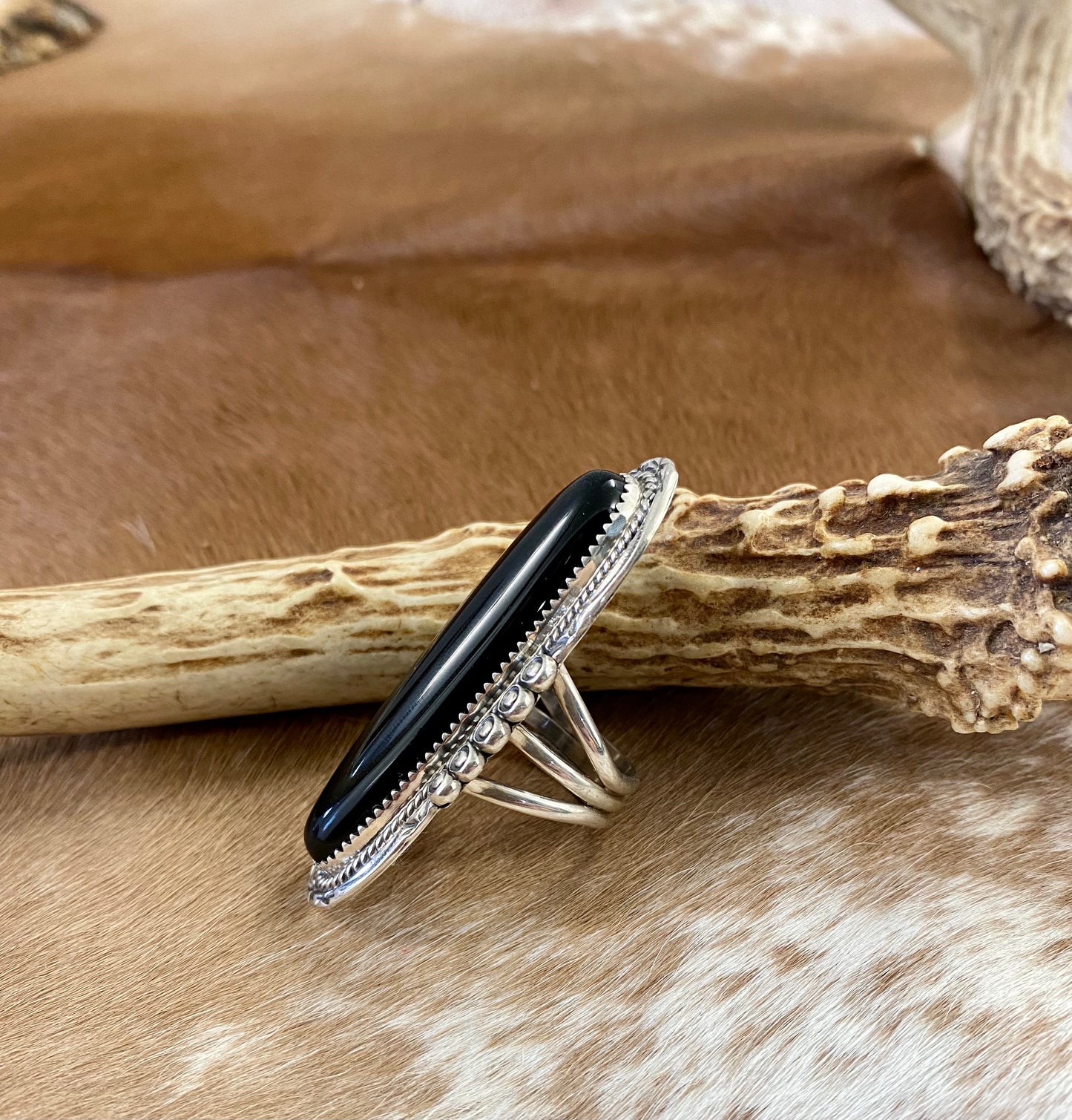 Large sterling silver onyx single stone Native made statement size 8.5 ring. Stamped sterling and signed PY by Native American artist silversmith Phillip Yazzie. The perfect piece to add to anyone's jewelry collection. Size: 2 1/4” inches length x 1” inch width Ring Size: 8.5 Signed: YES "PY" Hallmark/Artist: Phillip Yazzie Stone: Onyx