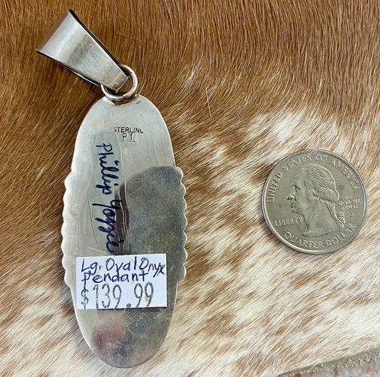 The perfect single stone sterling silver Native American made large onyx pendant to add to any necklace. This piece will look especially gorgeous on a strand of Navajo pearls. Stamped sterling and signed PY by Native artist silversmith Phillip Yazzie. Size: 2.5” inch length + bale .75” inch Signed: YES "PY" Hallmark/ Artist: Phillip Yazzie Stone: Onyx Large Black Onyx Pendant Handmade By Native American Phillip Yazzie