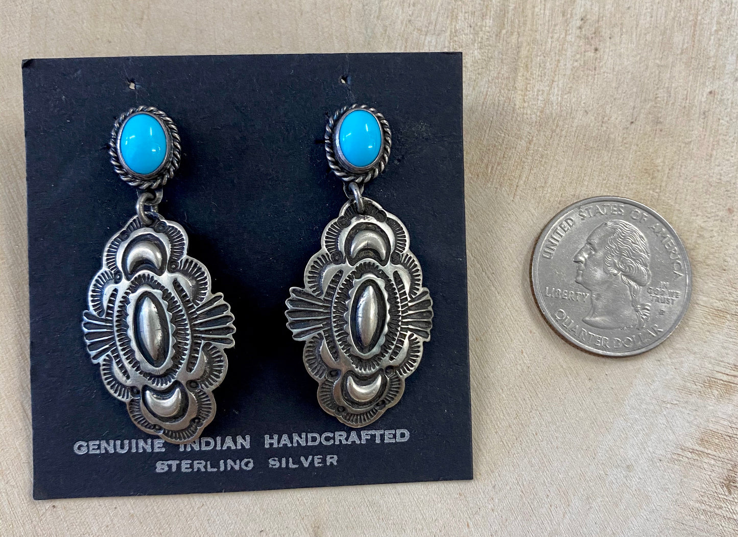 The D. Cadman Turquoise Earrings - Ny Texas Style Boutique Turquoise post sterling silver dangle statement earrings, signed and made by Native American artist silversmith Darrell Cadman. These beauties are Native made stamped sterling and signed "D. Cadman" on the back. Size: 1.75” Inches length Stone: Turquoise Signed: YES "D. Cadman" Artist/Hallmark: Darrell Cadman