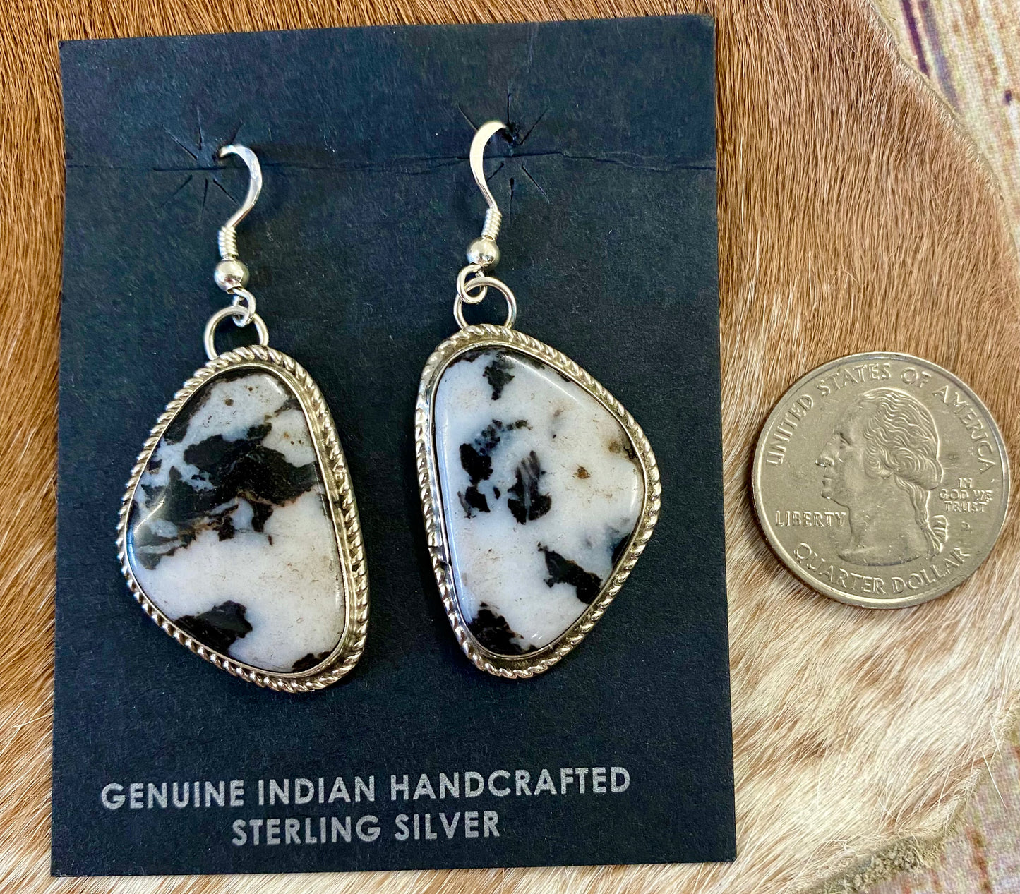 Stunning large statement hook sterling silver white buffalo native made earrings. Stamped sterling and signed by Native American artist silversmith Marcella James. These will make for a beautiful addition to anyone's jewelry collection. Size: 1.5 inches length x 1” inches width Signed: YES "MARCELLA JAMES" Hallmark/Artist: MARCELLA JAMES Stone: White Buffalo