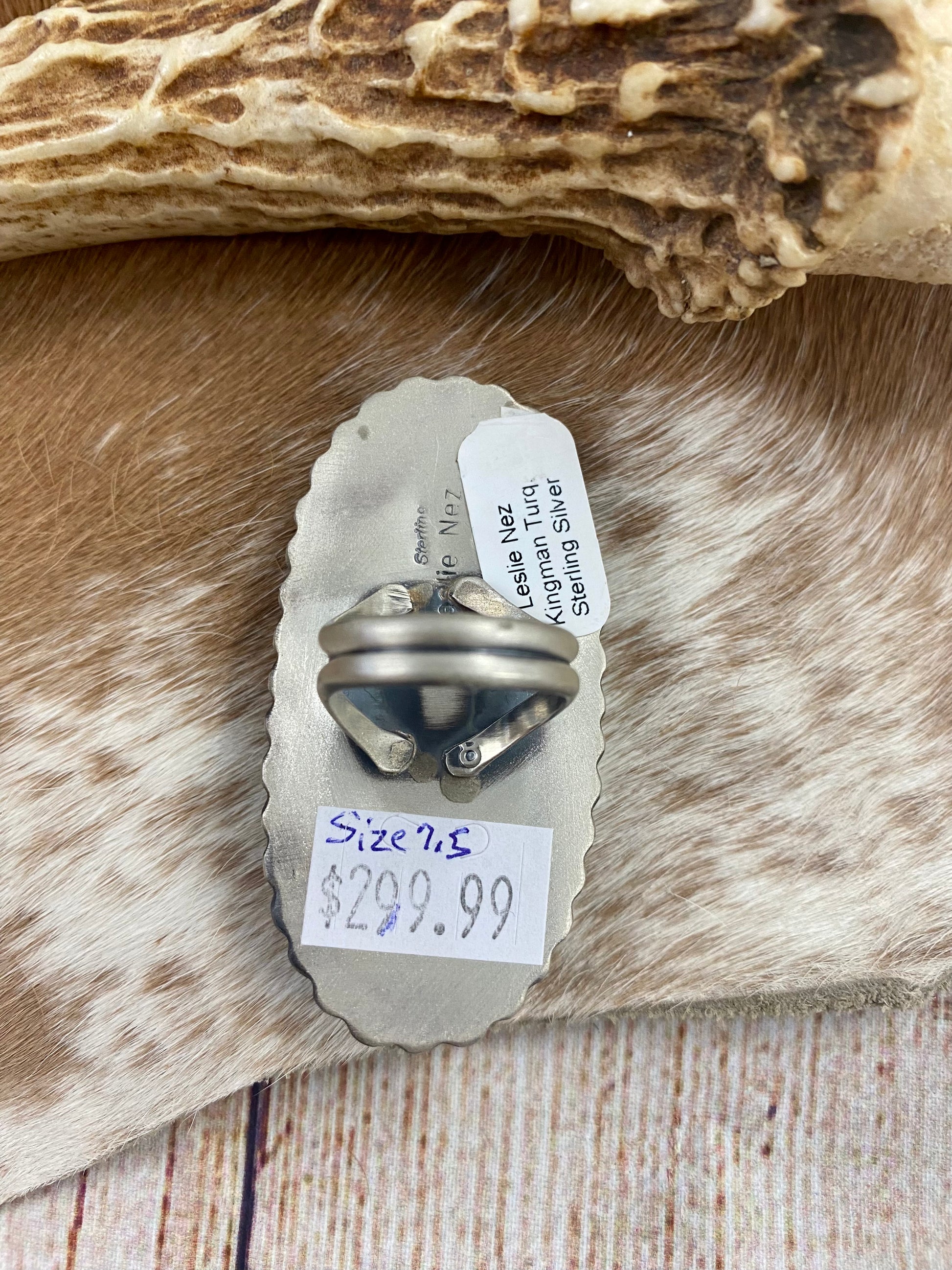 Kingman turquoise single-stone sterling silver large ring. Stamped sterling and signed "Leslie Nez” on the back by Native American artist silversmith Leslie Nez. Available in size 7.5. The perfect piece to add to your accessory wardrobe and jewelry collection.   Size: 2.5 Inches Length X 1 1/4” Inch Width    Stone: Kingman Turquoise   Signed: YES “Leslie Nez”   Hallmark: Leslie Nez