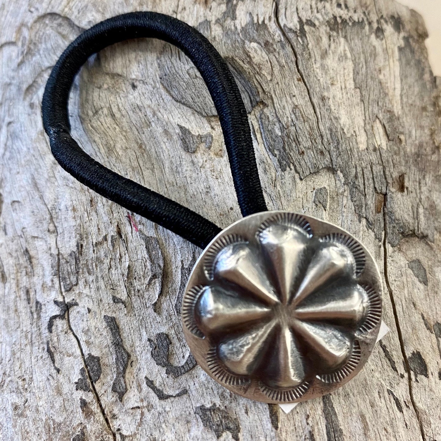 Silver concho style black hair tie. Handmade simple yet striking hair accessory to spice up any hairdo. The perfect addition to any outfit for any occasion. Add it in to your braid or ponytail. Concho hair tie - Western hair tie  - Western Hair Accessories