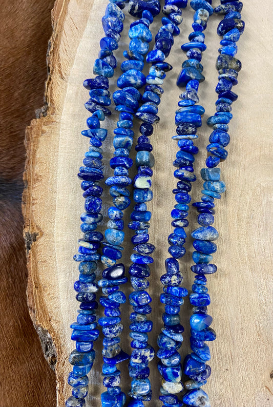 Absolutely stunning sterling silver clasp five strand hand strung blue Lapis and heishe 27” inch length necklace. The shades of blue in this piece are out of this world amazing! This necklace will make a statement with any outfit. Size: 27" Inches Length Stone: Blue Lapis