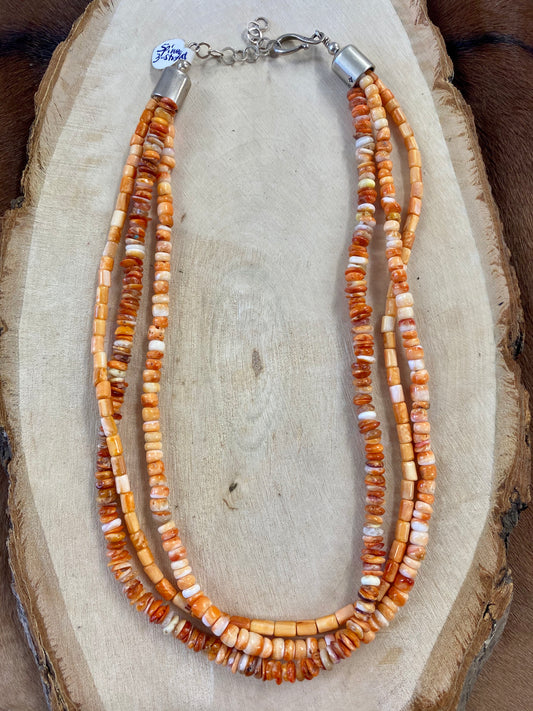 The Three Strand Spiny Oyster Necklace - Ny Texas Style Boutique Authentic Spiny oyster Sterling silver triple strand 18” length necklace. This beauty is stamped by it’s artist on the clasp. Please see photos for details. Pair with a pendant, layer with other necklaces, or wear this beauty alone. The styling options are endless.   Size:  Length: 18”
