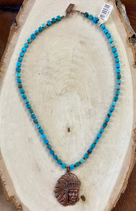 18" Inch Turquoise Necklace By J. Forks With Cooper Chief Pendant 18” Inch length Turquoise cube single strand necklace with cooper chief pendant. This necklace is made by J. Forks and is stamped on the end by the clasp stating so. This necklace is perfect to wear alone or layered amongst other necklaces. The perfect western necklace to wear to your next rodeo or concert.