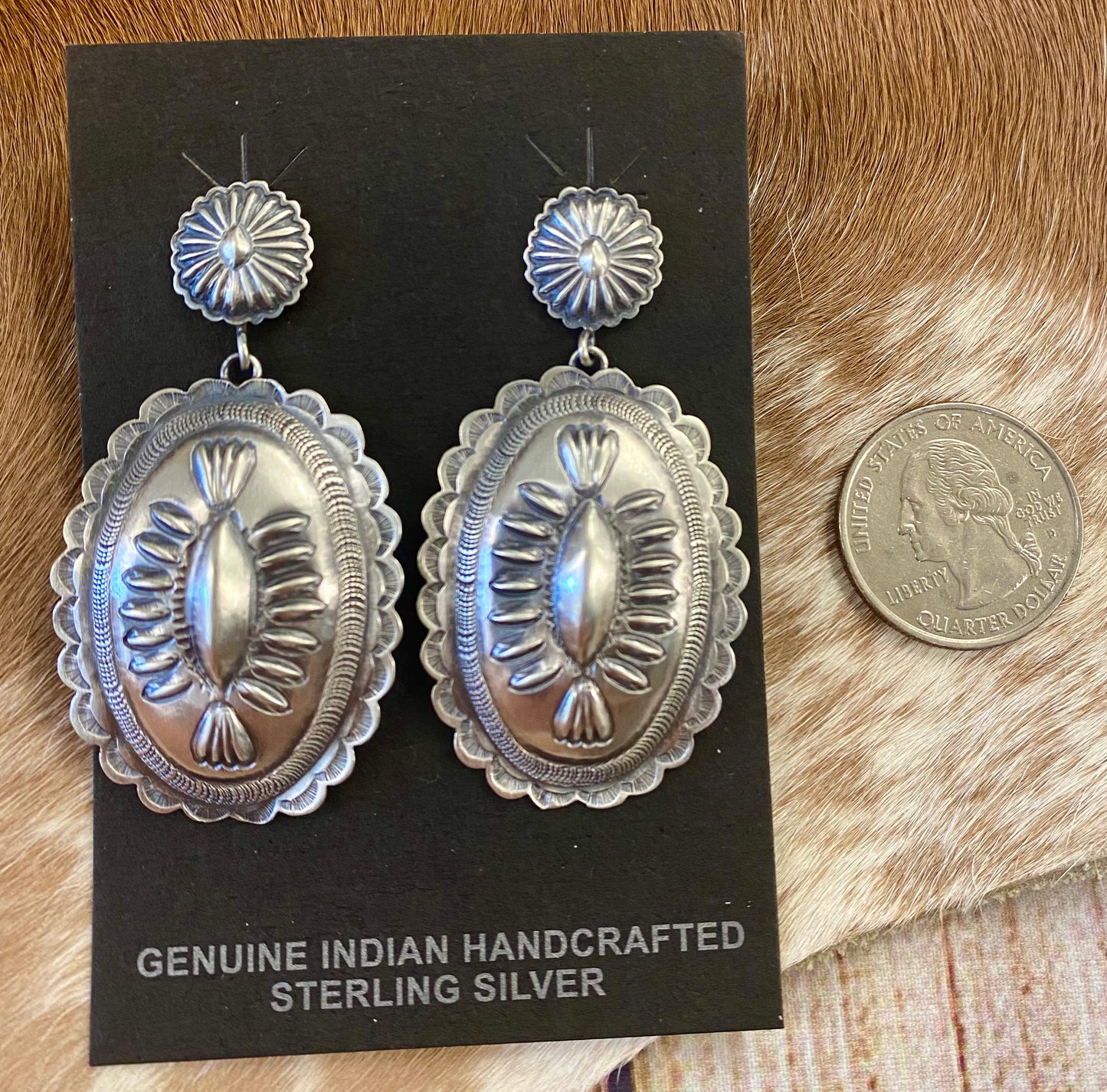 Stunning large statement Concho post sterling silver Native American made signed earrings. The perfect earrings to add to anyone's jewelry collection. The stamping adds a unique and elegant look. Handmade by Native American artist silversmith D Tom Charlie. Size: 2” inch length Signed: YES Hallmark/Artist: D Tom CharlieThe Creager Silver Concho Earrings By D Tom Charlie