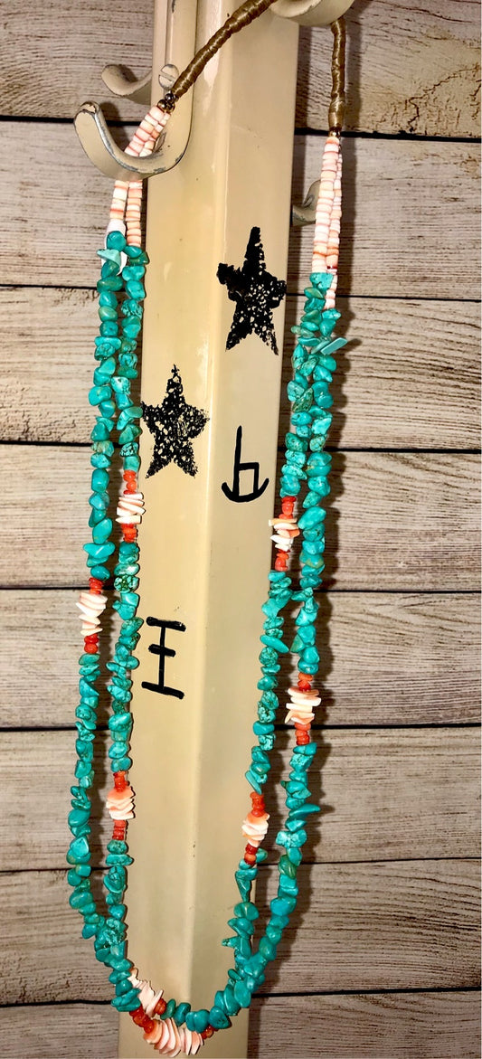 Native American Made 2 Strand Turquoise, Coral, Spiny Oyster Necklace This handmade necklace is a absolute beauty. A stunning Native made two-strand turquoise, coral, and spiny oyster necklace. Layer it or wear it alone or add a pendant to keep your look totally unique. The perfect dainty layering piece! Simple, yet striking! Size: 29" Inches Length Stone: Turquoise, Coral. and Spiny Oyster