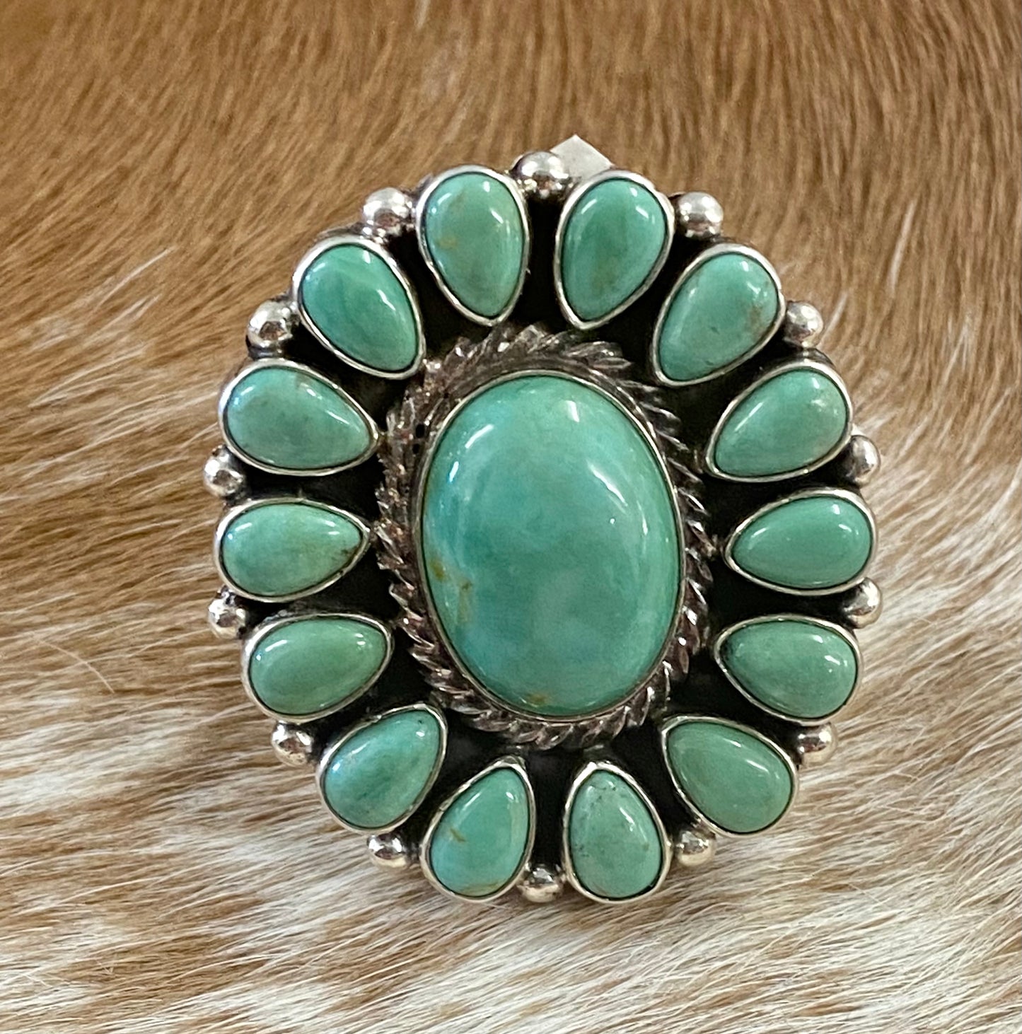 Sterling silver Tyrone Turquoise multi-stone turquoise cluster handmade unique statement size 7 1/4 ring. The perfect piece to add to anyone's jewelry collection. Size: Length 1 1/4” x 1 1/4” inches width Ring Size: 7 1/4 Signed: YES Symbol Stone: Tyrone Turquoise
