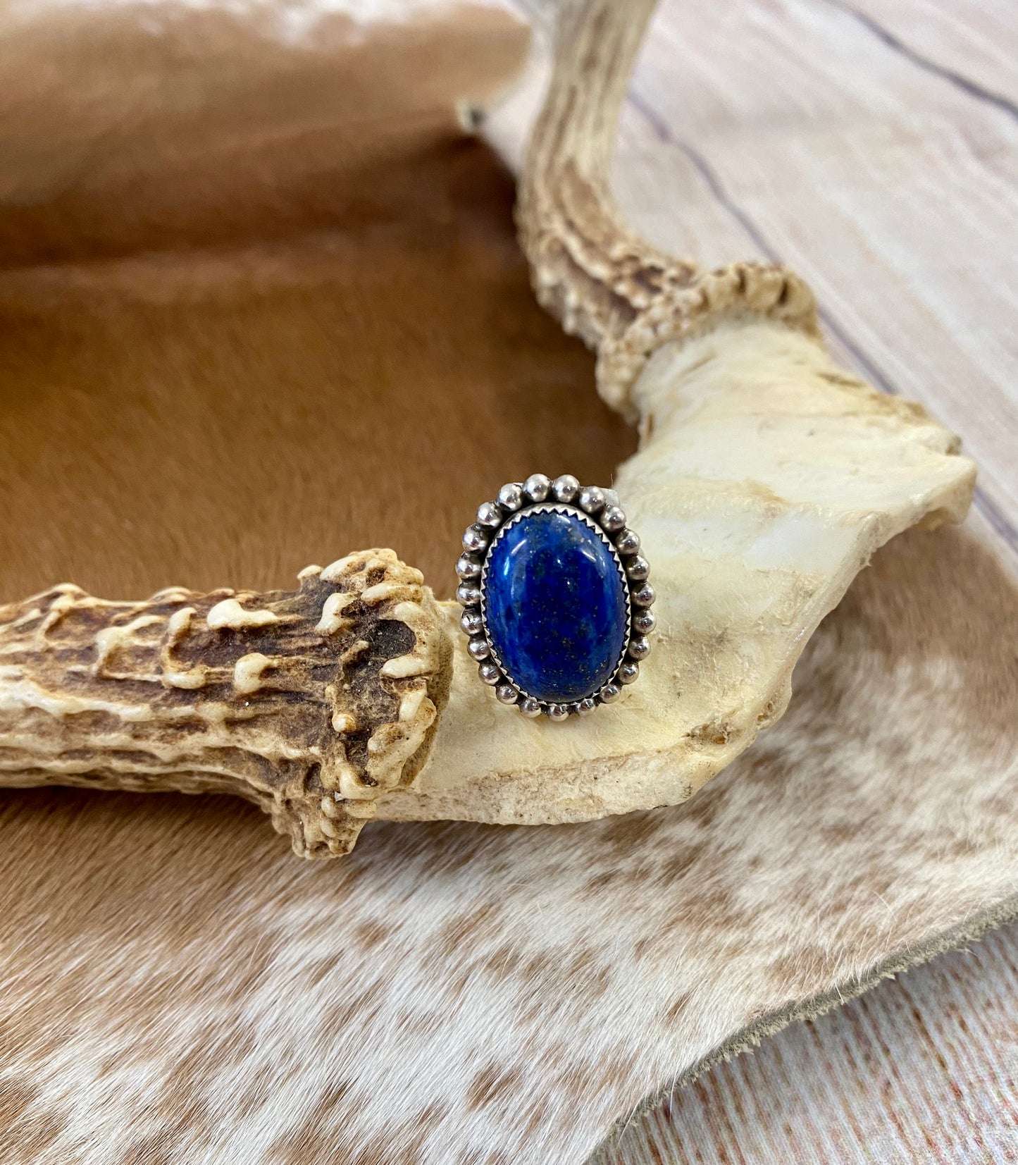 Beautiful single stone simple yet striking sterling silver blue lapis round size 7 ring. This piece is stamped Sterling and signed B on the back by Native American artist silversmith. A gorgeous ring that will add a pop of color to any outfit. Signed: YES “B” Ring Size: 7 Size: 1” inch length Stone: Blue Lapis