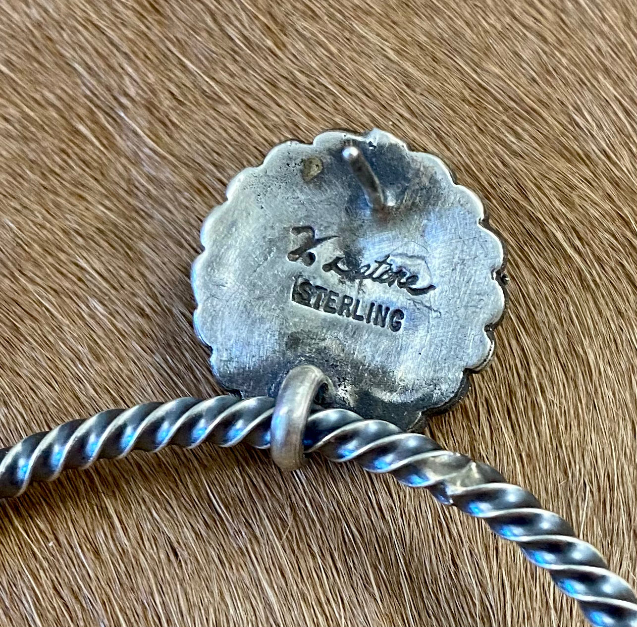 Large post sterling silver hoop rope Native American made earrings. Stamped sterling and signed V. betone by Native artist silversmith Verley Betone on the back of the post part. Lightweight and fun earrings for any outfit or occasion. The perfect addition to anyone's jewelry collection! Hallmark/ Artist: Verley Betone Signed: YES V. betone Size: 2" Inches Hoop Rope Silver Earrings Made By Native American Artist Verley Betone