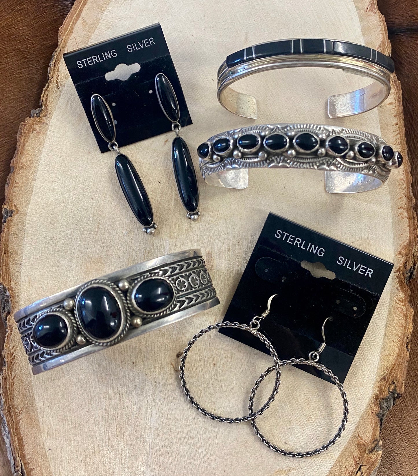 Triple Stone Handmade Native Made Black Onyx Cuff Bracelet Signed JA Sterling silver three stone black Onyx cuff with stamped detailing throughout the cuff. Stamped sterling and signed JA on the inside of the cuff, see photos for exact hallmark/artist stamp. This onyx cuff is so classic and will easily become one of your favorite accessories! Size: 6.5” Inch length of the cuff (not including gap) | .8” of an inch thick Signed: YES "JA" Stone: Onyx