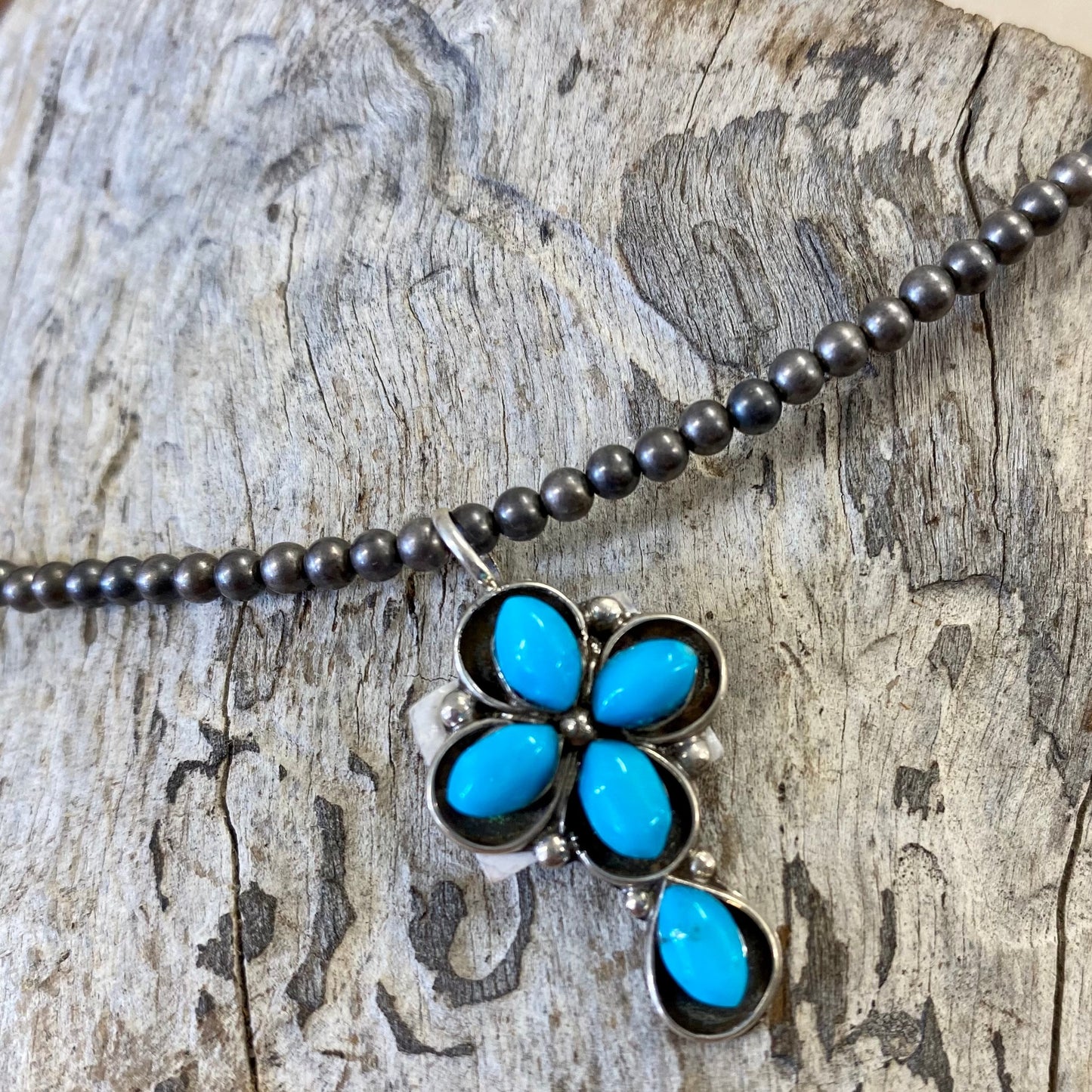 Abraham Turquoise Cross Pendant Charm | Native Made Turquoise Jewelry Small turquoise cross pendant/ charm handmade with Sterling Silver. The perfect addition to any charm bracelet or re strung on to a strand of Navajo Pearls. Beautiful addition to your everyday jewelry. The perfect piece to give us a gift to your loved one or keep for yourself!