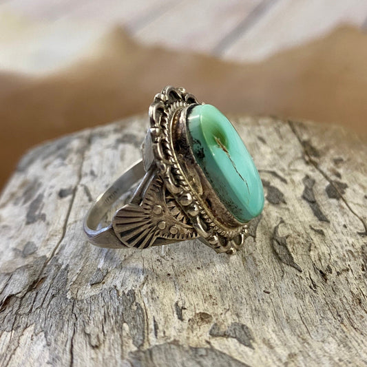 Vintage turquoise ring detail on band size 10.5 stamped sterling and signed JCY on back. This beauty is Native made and will make for a beautiful statement piece in your jewelry collection. Size: 1” Inch length Ring Size: 10.5 Stone: Turquoise Signed: YES "JCY"