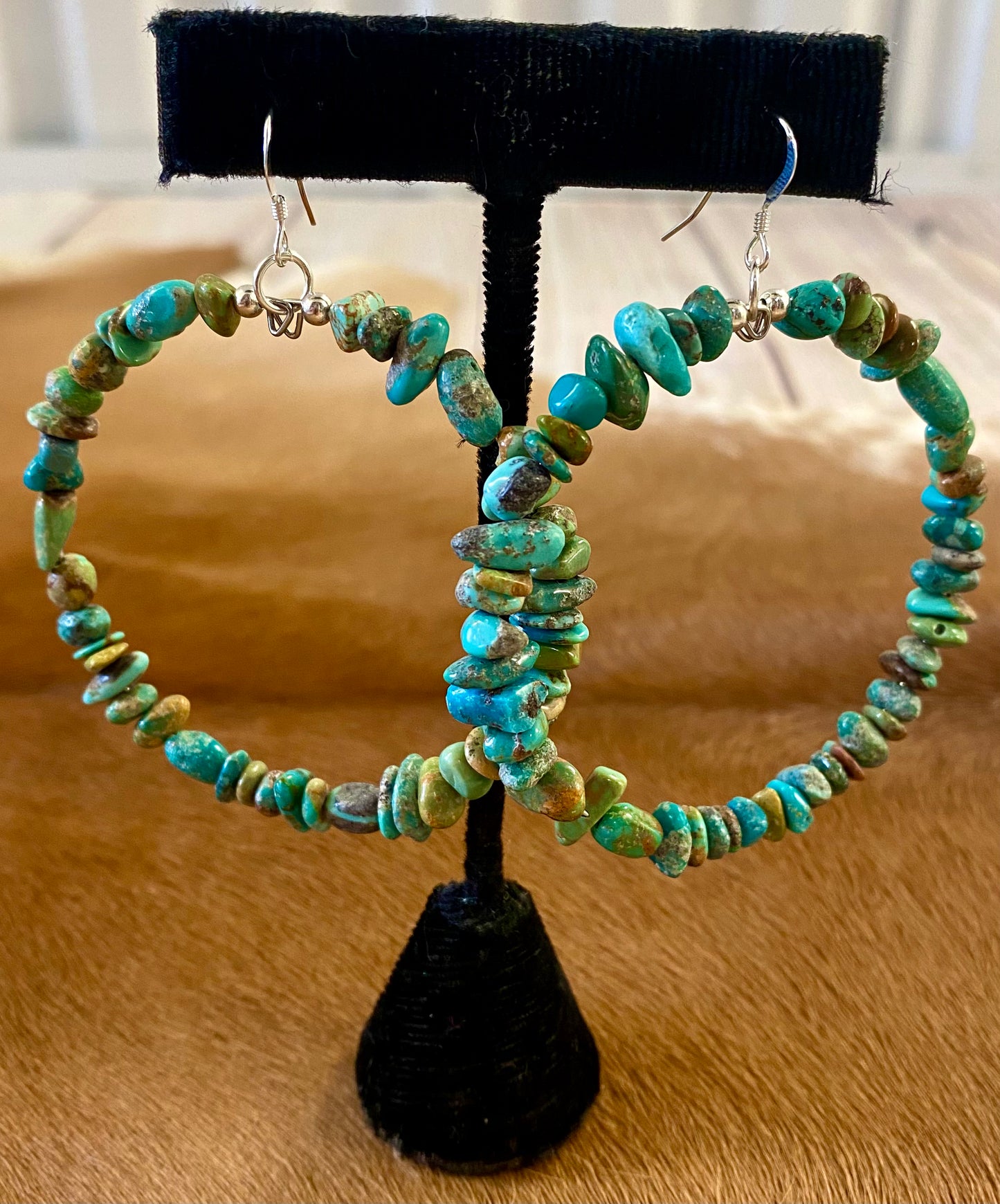 Handmade turquoise beaded Native American made hoop hook sterling silver earrings. Native American beaded hoop earrings will make for the perfect gift for your loved one or for your own jewelry collection! The perfect statement or everyday Native American beaded hoop earrings to add to your jewelry collection! These are lightweight and easy to pair with almost any outfit! Size: 2.5” Inches width X 2” Inches length Stone: Turquoise